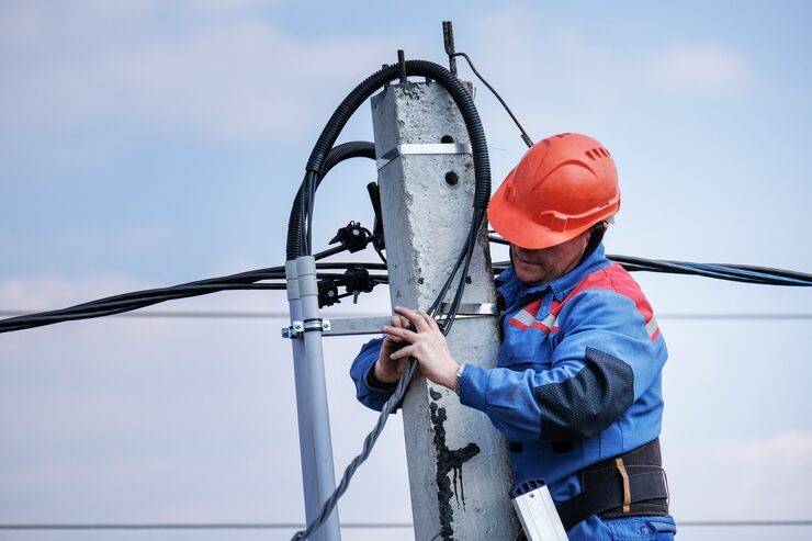 electrical engineer performs wiring high pole standing stairs high rise electrical work podkluchenie house power lines 414160 60