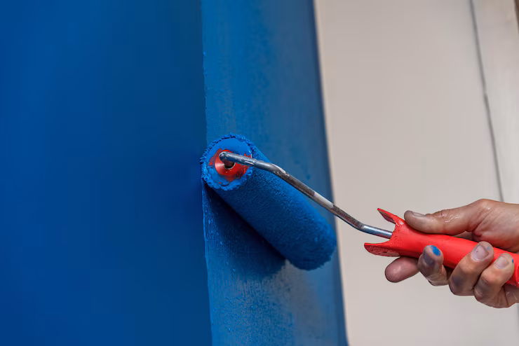 workman painting wall blue 1244847 355